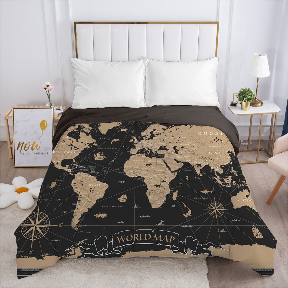 Housse de couette carte du monde noir et blanc sur un lit Housse de couette carte du monde noir et blanc dépliée sur un lit